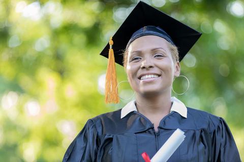 Woman graduating in cap and gown